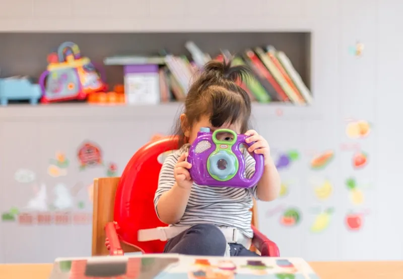 Child reading a book with focused attention