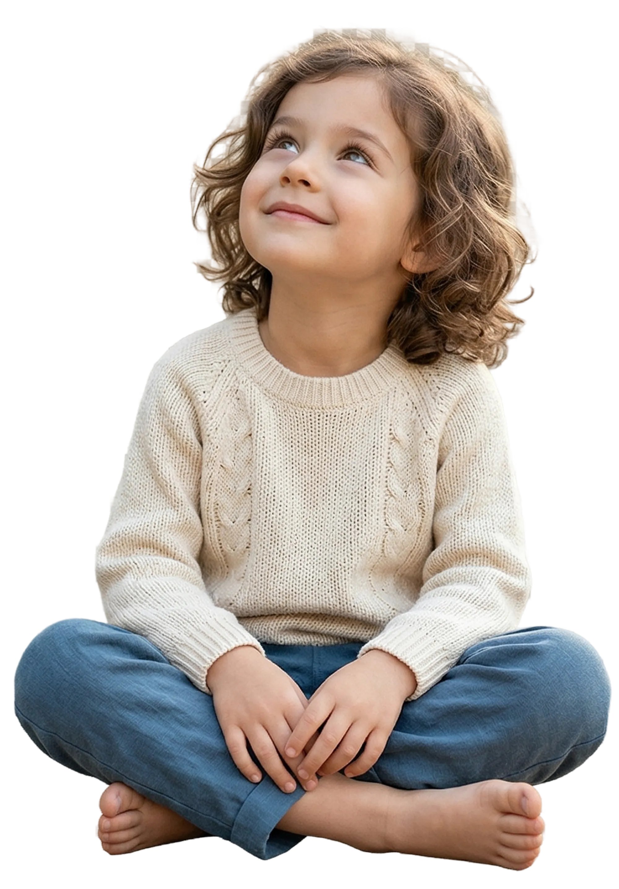 A curly-haired child in a cozy sweater looking upward, lost in imagination